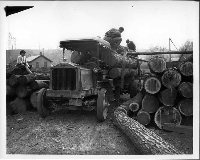 Early 1900s Packard truck at logging camp