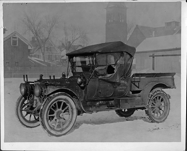 1910 Packard truck of Oliver & Howland Co. parked in snow