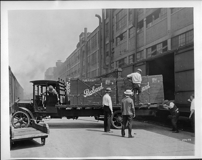 1921-22 Packard truck, left side view, unloading Packard crates into boxcars