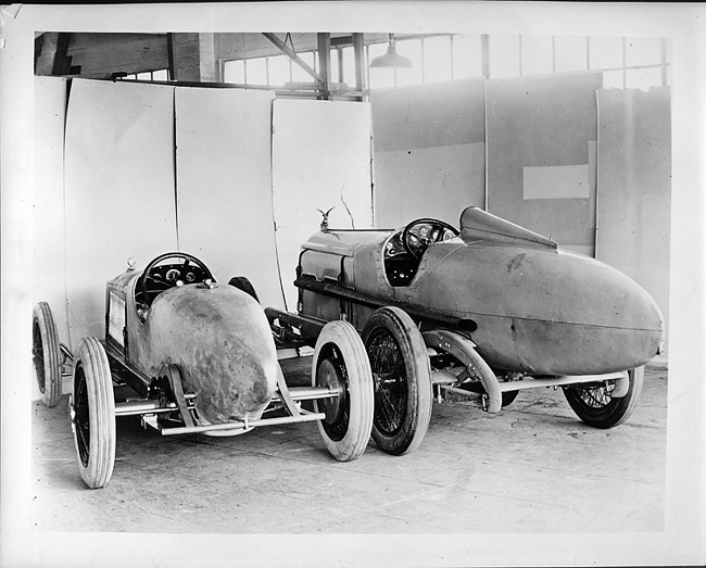 1923 Packard race car with 1919 Packard race car, three-quarter rear view