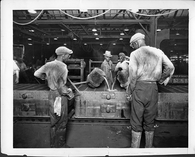 African-American workers pouring molten metal in Packard factory, 1928