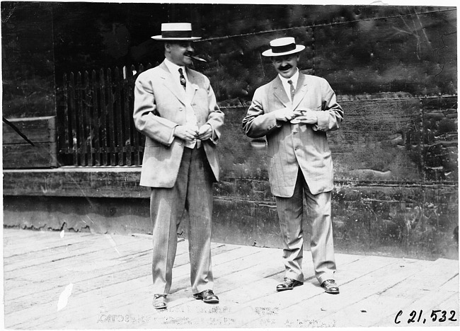Two men on dock, 1909 Glidden Tour, Detroit, Mich.