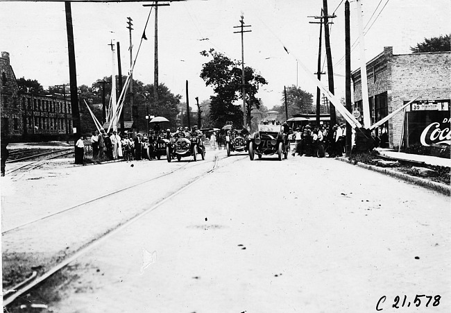 Crowd gathers to watch cars in Jackson, Mich. in 1909 Glidden Tour