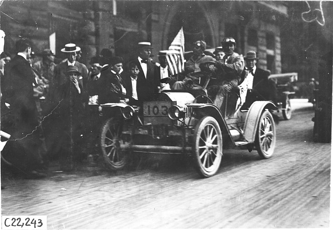 Brush runabout car # 103 with driver and three passengers at the 1909 Glidden Tour