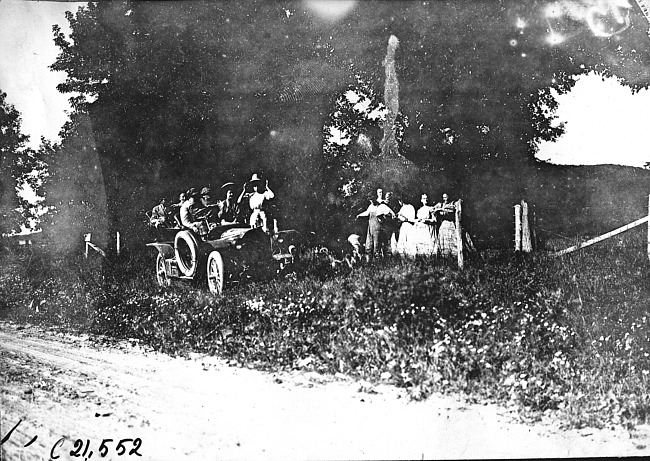 Women looking at Studebaker car near Baraboo, Wis., 1909 Glidden Tour