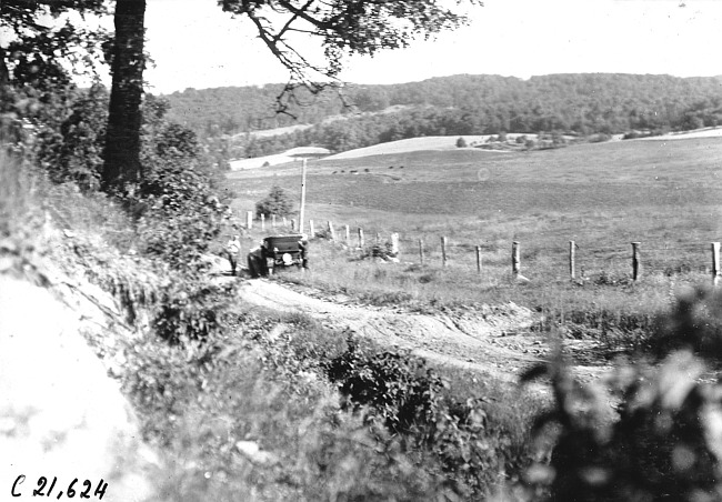Studebaker press car off the road after breaking a wheel at 1909 Glidden Tour