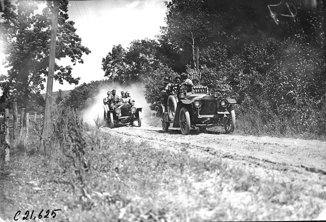 Studebaker cars on rural road at 1909 Glidden Tour
