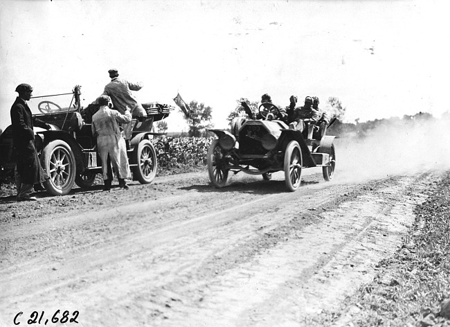 Van Dervoort in Moline car passing a press car outside of La Crosse, Wis., 1909 Glidden Tour