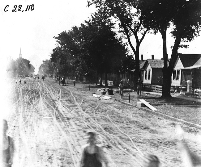Rural street with houses in Winona, Wis., 1909 Glidden Tour