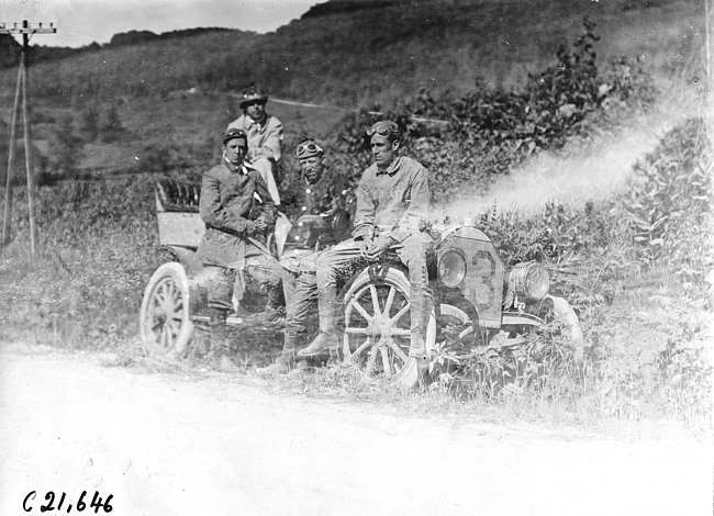 Harry Bill and three passengers posed in car along roadside in Pleasant Valley, Minn. at the 1909 Glidden Tour