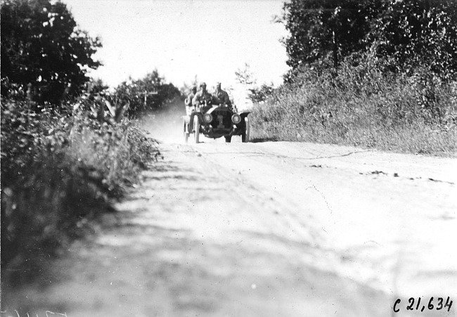 Webb Jay in Premier car passing through Pleasant Valley, Minn. at the 1909 Glidden Tour