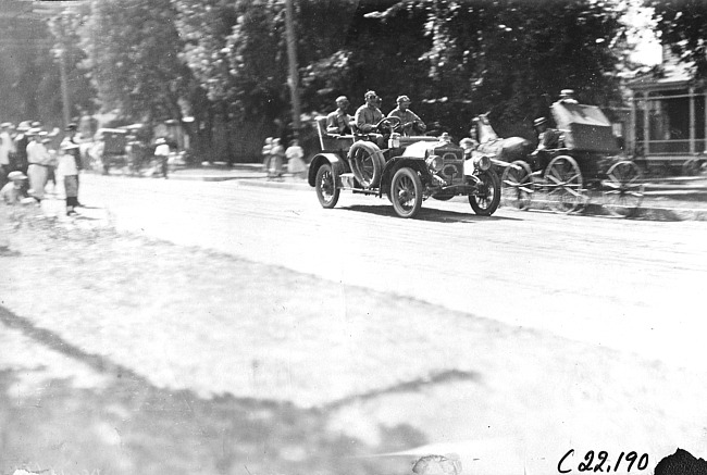 E.G. Gager in Maxwell car passing through Pleasant Valley, Minn. at the 1909 Glidden Tour