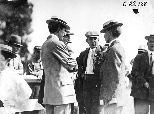 Mr. Savage and Mr. Birmingham in a group of men at race track in Minnesota, at the 1909 Glidden Tour