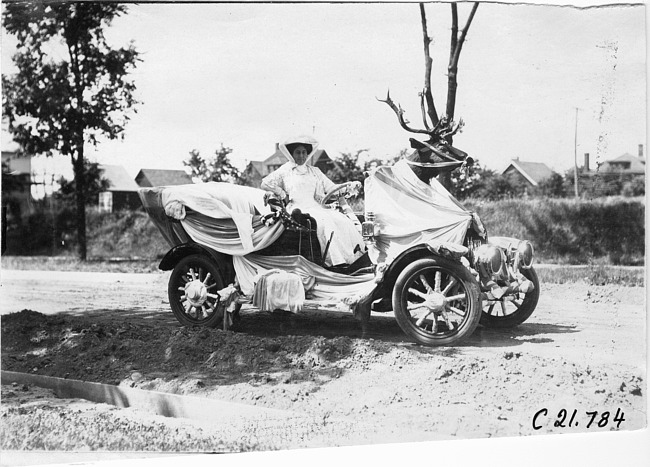 Mrs. Mullen in Mora decorated car at the parade in Minnesota, at the 1909 Glidden Tour