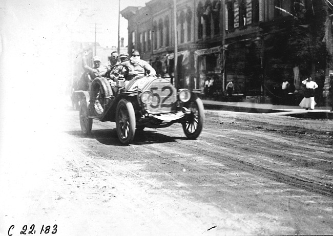 Jean Bemb in Chalmers car passing through Faribault, Minn., at 1909 Glidden Tour