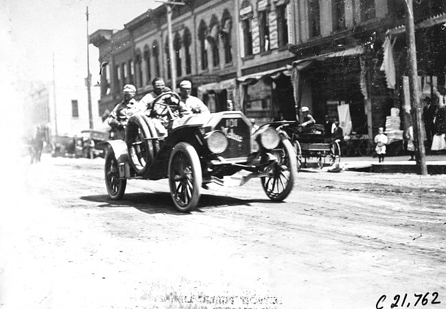 J.M. Wicks in Moline car passing through Faribault, Minn., at 1909 Glidden Tour