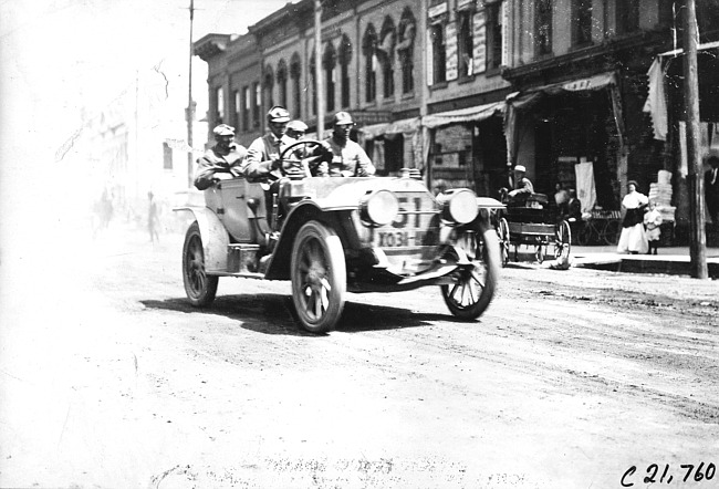 A.W. Woods in Simplex car passing through Faribault, Minn., at 1909 Glidden Tour