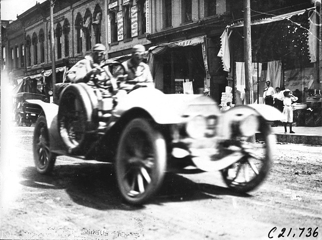 Charles Schofield in Pierce-Arrow car passing through Faribault, Minn., at 1909 Glidden Tour