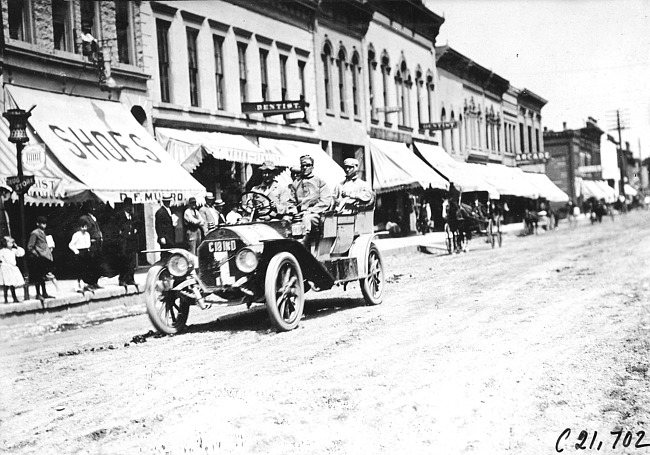 Webb Jay in Premier car passing through Faribault, Minn., at 1909 Glidden Tour