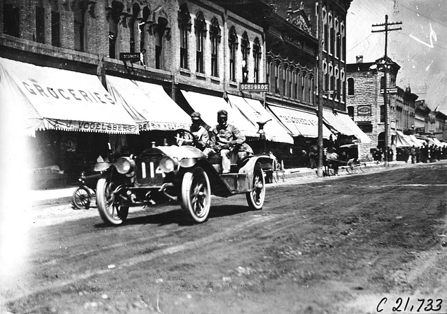John C. Moore in Lexington car passing through Faribault, Minn., at 1909 Glidden Tour