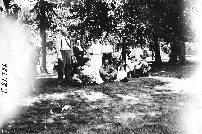 Glidden tourists posing with Judge McDermott in park at Madison Lake, Minn., at 1909 Glidden Tour