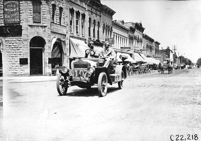 Charles Goldthwaite in Maxwell car passing through Madison Lake, Minn., at 1909 Glidden Tour