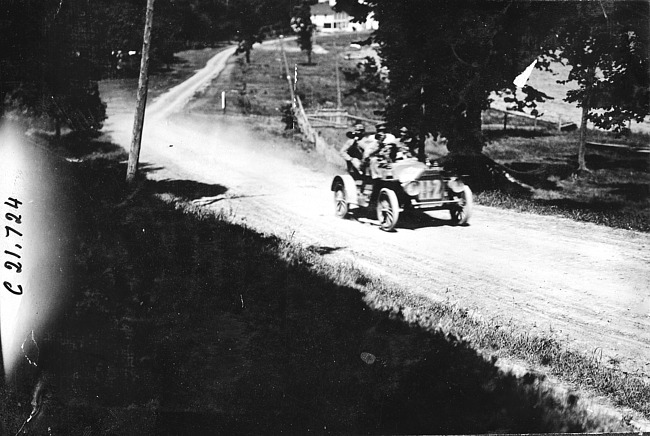 Duesenberg in Mason car on the road to Mankato, Minn., at 1909 Glidden Tour