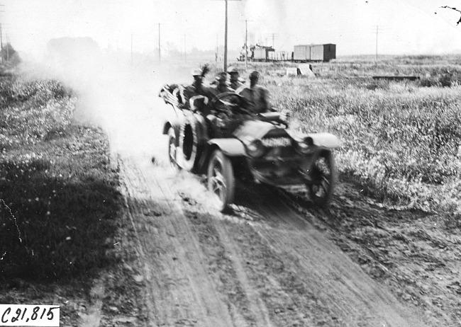 F. Wing in Marmon car on rural road near Missouri Valley, Iowa at 1909 Glidden Tour