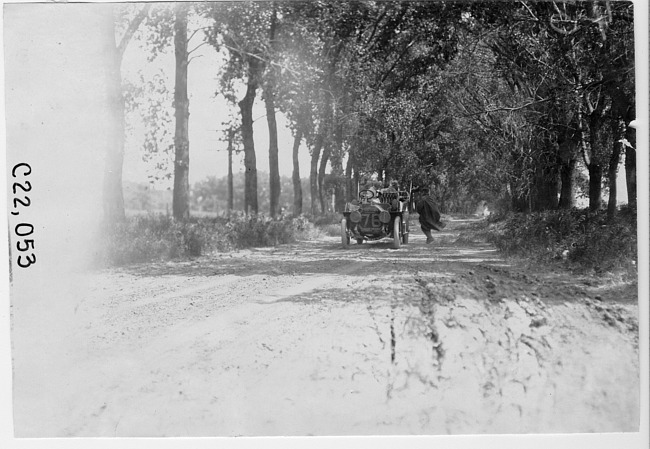 Thomas car #76 on road lined with trees, at the 1909 Glidden Tour