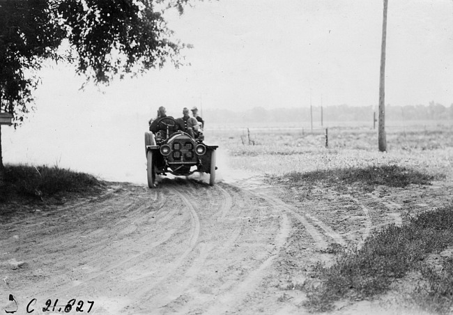 Henry Bill in Chalmers car rounding a turn near Wood River, Neb., at 1909 Glidden Tour