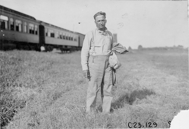 Glidden tourist stands near Pullman car in Kearney, Neb., at 1909 Glidden Tour