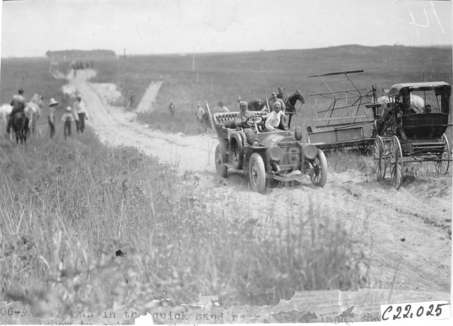 Participants' car passing through sand in Neb., at the 1909 Glidden Tour