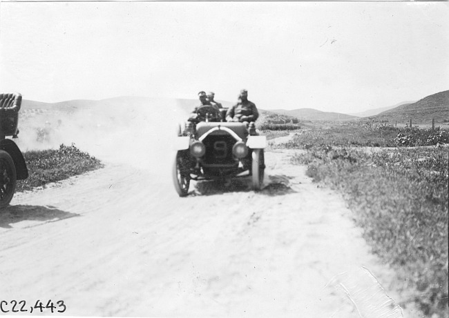W.F. Winchester driver in Pierce car among the foothills in Neb., at the 1909 Glidden Tour