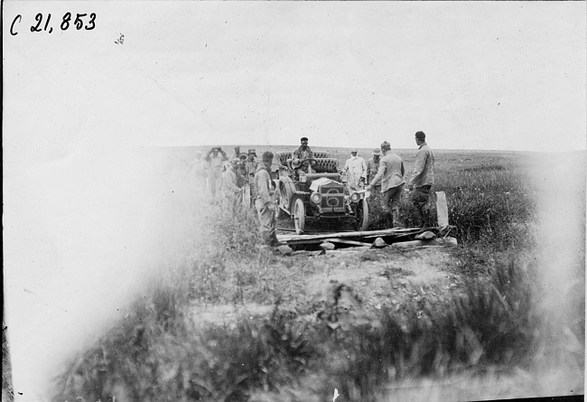 Driver E.G. Gager crossing a bad ditch on the prairie at the 1909 Glidden Tour