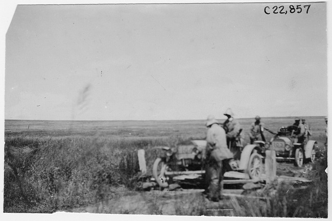 Participant crossing a bad ditch on the prairie at the 1909 Glidden Tour