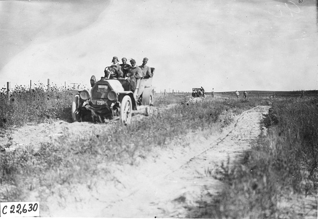 Jewel car on sandy road on the Colorado prairie, at 1909 Glidden Tour