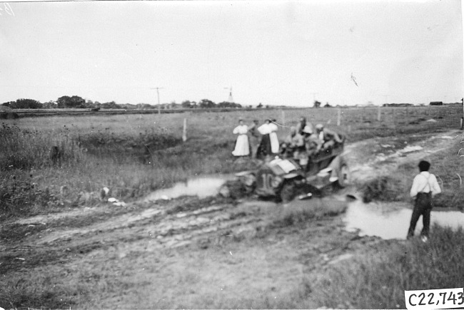 Glidden tourist vehicle stuck in mud on Colorado prairie, at 1909 Glidden Tour