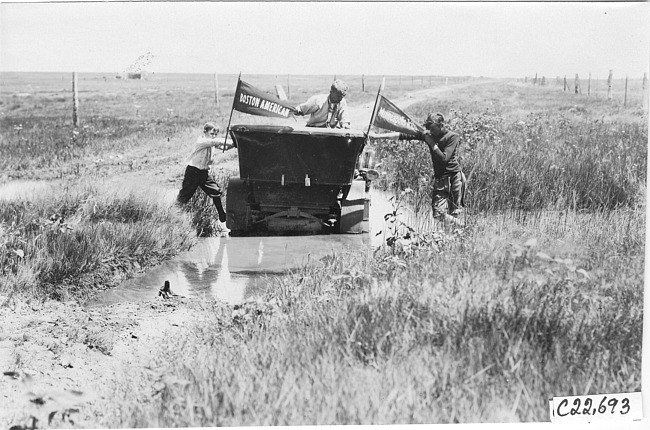 Glidden tourist vehicle stuck in mud on Colorado prairie, at 1909 Glidden Tour