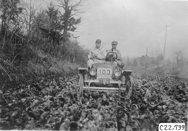 Glidden tourist vehicle on muddy road in Colorado, at 1909 Glidden Tour