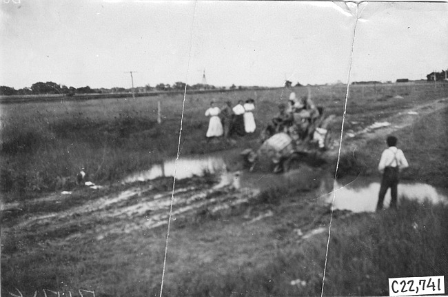 Glidden tourist vehicle stuck in mud on Colorado prairie, at 1909 Glidden Tour