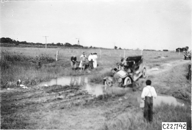 Glidden tourist vehicle stuck in mud on Colorado prairie, at 1909 Glidden Tour