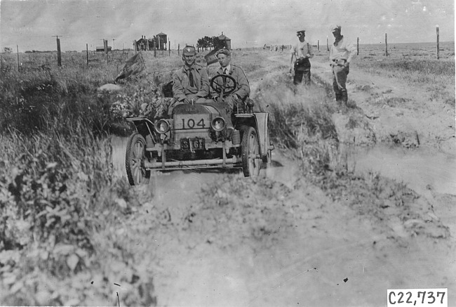 Glidden tourist vehicle stuck in mud on Colorado prairie, at 1909 Glidden Tour