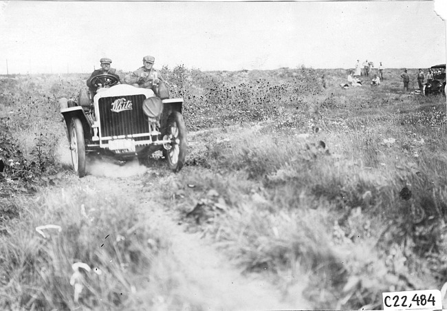 Glidden tourists in White car on the Colorado prairie, at 1909 Glidden Tour