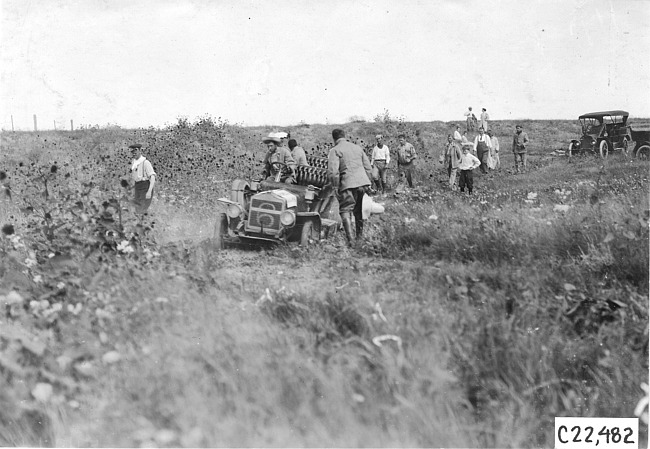 Glidden tourists come to the aid of car #6 stuck in the mud on the Colorado prairie, at 1909 Glidden Tour