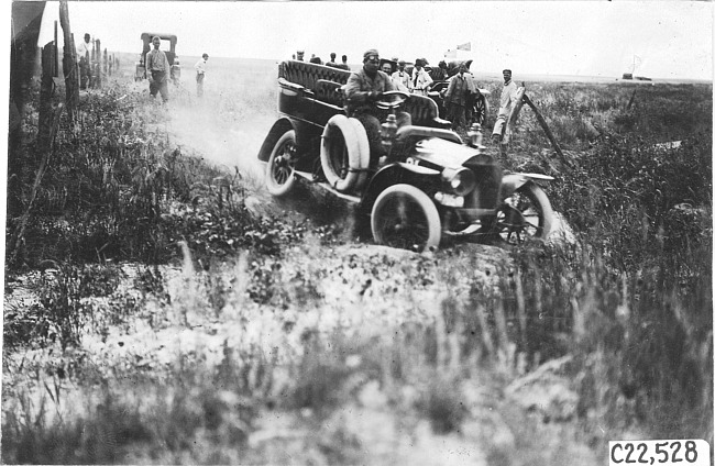 Studebaker press car hits a hole on the Colorado prairie, at 1909 Glidden Tour