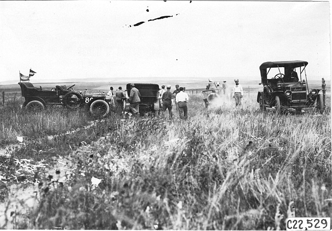 Studebaker press car and other Glidden tourist vehicles on the Colorado prairie, at 1909 Glidden Tour