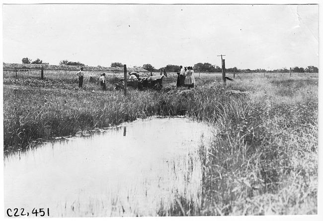 Studebaker press car stuck in ditch near Aurora, Colo., at 1909 Glidden Tour