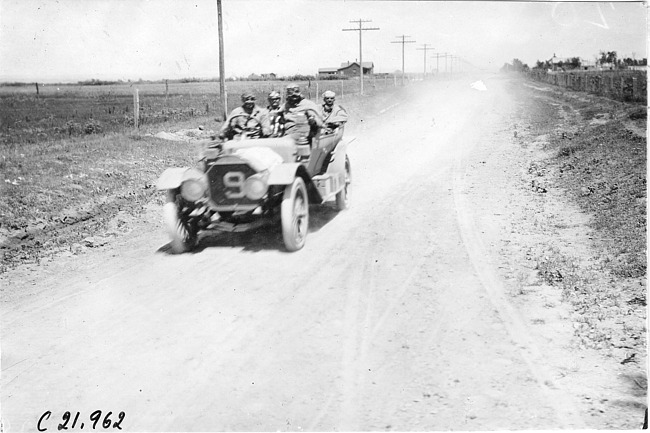 W.F. Winchester in Pierce car #9 on the road near Denver, at the 1909 Glidden Tour
