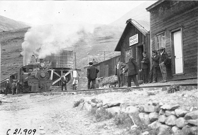 George Schuster stands in front of Waldorf Post Office, Colo., at 1909 Glidden Tour