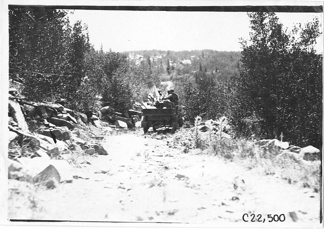 Rapid motor truck on rock covered mountain road in Colo., at 1909 Glidden Tour